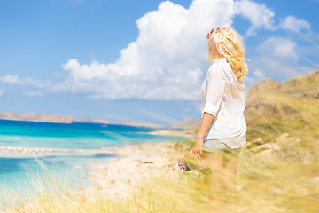 Image showing Free Happy Woman Enjoying Sun on Vacations.