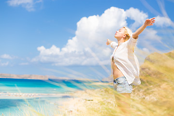 Image showing Free Happy Woman Enjoying Sun on Vacations.