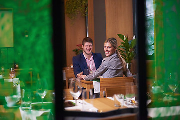 Image showing business couple having dinner