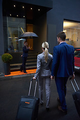 Image showing business people couple entering  hotel