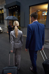 Image showing business people couple entering  hotel