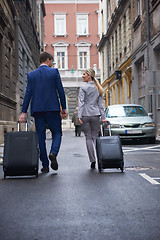 Image showing business people couple entering  hotel