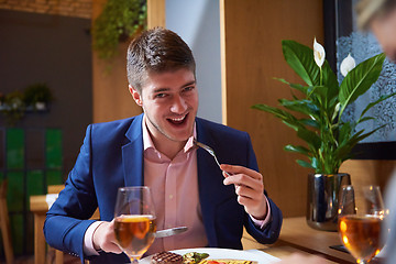 Image showing business couple having dinner