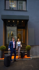 Image showing business people couple entering  hotel