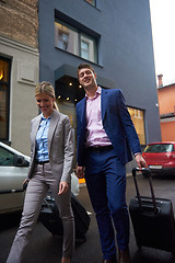 Image showing business people couple entering  hotel