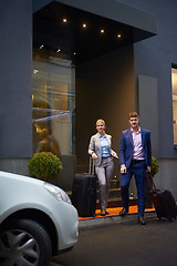 Image showing business people couple entering  hotel