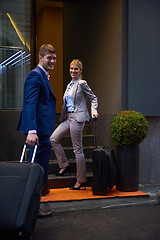 Image showing business people couple entering  hotel