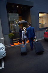 Image showing business people couple entering  hotel