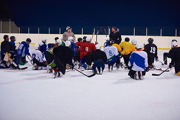 Image showing ice hockey players team meeting with trainer