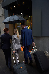 Image showing business people couple entering  hotel