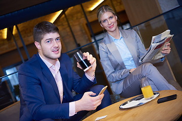 Image showing business couple take drink after work