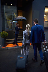 Image showing business people couple entering  hotel