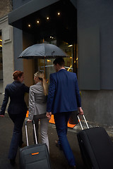 Image showing business people couple entering  hotel