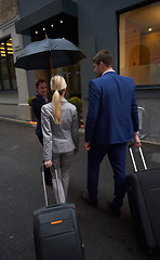 Image showing business people couple entering  hotel