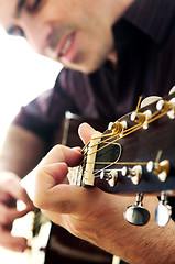 Image showing Man playing a guitar