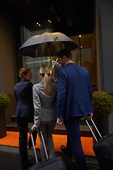 Image showing business people couple entering  hotel