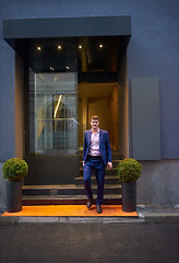 Image showing business man entering  hotel