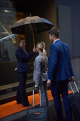 Image showing business people couple entering  hotel