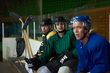 Image showing ice hockey players on bench