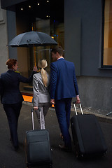 Image showing business people couple entering  hotel