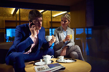 Image showing business couple take drink after work