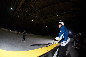 Image showing ice hockey players on bench