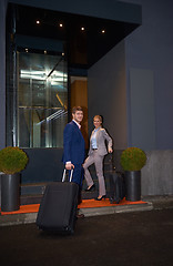 Image showing business people couple entering  hotel