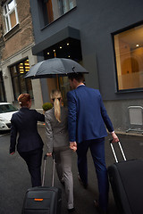 Image showing business people couple entering  hotel