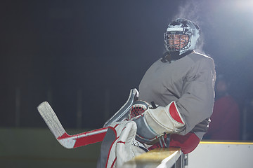 Image showing ice hockey players on bench