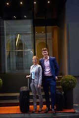 Image showing business people couple entering  hotel