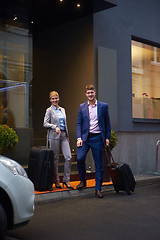 Image showing business people couple entering  hotel