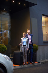 Image showing business people couple entering  hotel