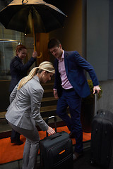 Image showing business people couple entering  hotel