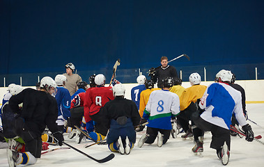 Image showing ice hockey players team meeting with trainer