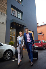 Image showing business people couple entering  hotel