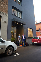 Image showing business people couple entering  hotel