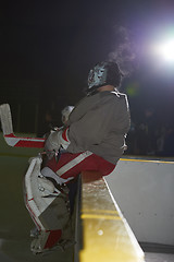 Image showing ice hockey players on bench