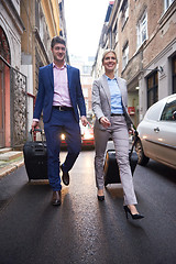 Image showing business people couple entering  hotel