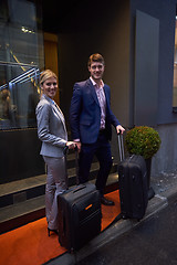 Image showing business people couple entering  hotel