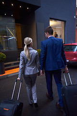 Image showing business people couple entering  hotel