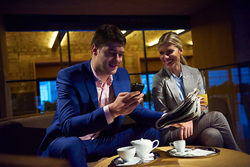 Image showing business couple take drink after work