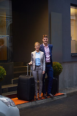 Image showing business people couple entering  hotel