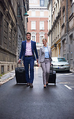 Image showing business people couple entering  hotel