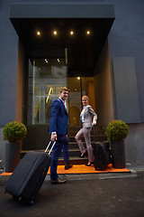 Image showing business people couple entering  hotel