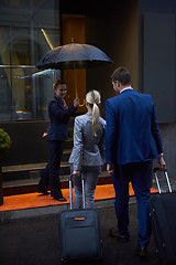 Image showing business people couple entering  hotel