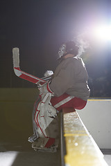 Image showing ice hockey players on bench