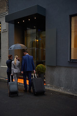 Image showing business people couple entering  hotel