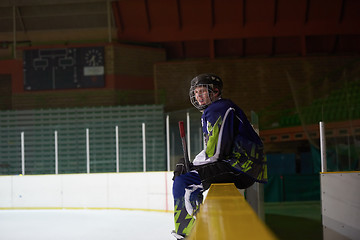 Image showing ice hockey players on bench