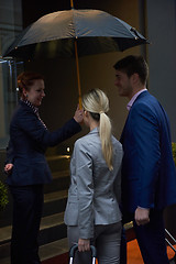 Image showing business people couple entering  hotel