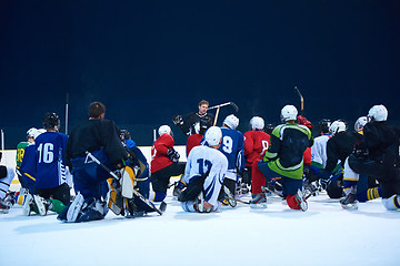 Image showing ice hockey players team meeting with trainer